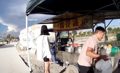 Popular online influencer [cikaimoon] takes a revealing walk outdoors; an elderly man forcibly takes her picture and they fight over her phone; she shops in a black, transparent sheer dress.