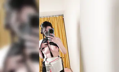 Twitter influencer with contrasting glasses, [Anaimiya], uses a black cat-shaped electric stun gun.