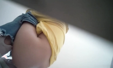 The tech building is guarded by a long-haired girl in yellow jeans with two big, fat labia.